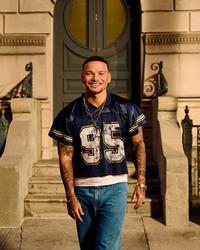Kane Brown wearing a football jersey