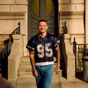 Kane Brown wearing a football jersey