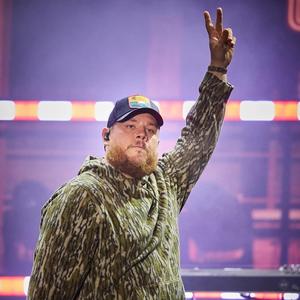 Luke Combs performing in camo