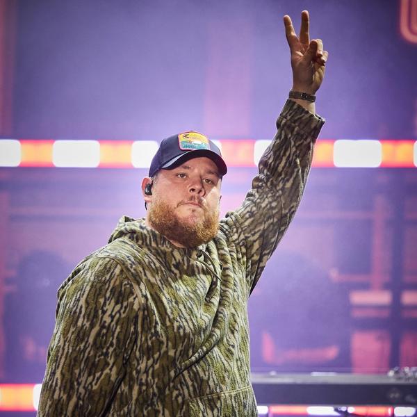 Luke Combs performing in camo
