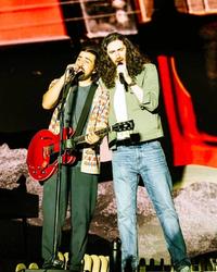 Noah Kahan and Hozier performing together at Railbird Festival 2025.