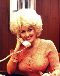 Dolly Parton staring in the film 9 to 5