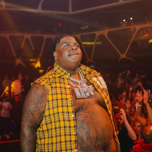BigXthaPlug wearing a yellow checked shirt
