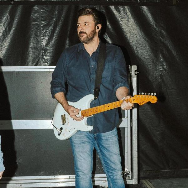 Chris Young holding a guitar