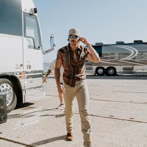 Tucker Wetmore walking off his tour-bus