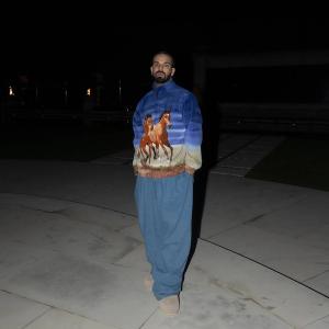 Drake wearing horses on his shirt