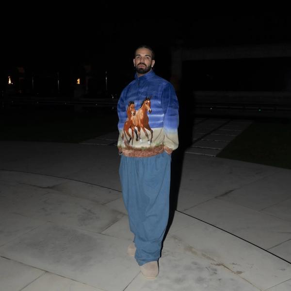 Drake wearing horses on his shirt