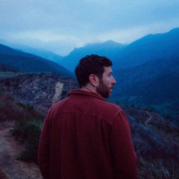 Brett Eldredge walking in the mountains