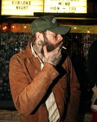 Post Malone smoking a cigarette