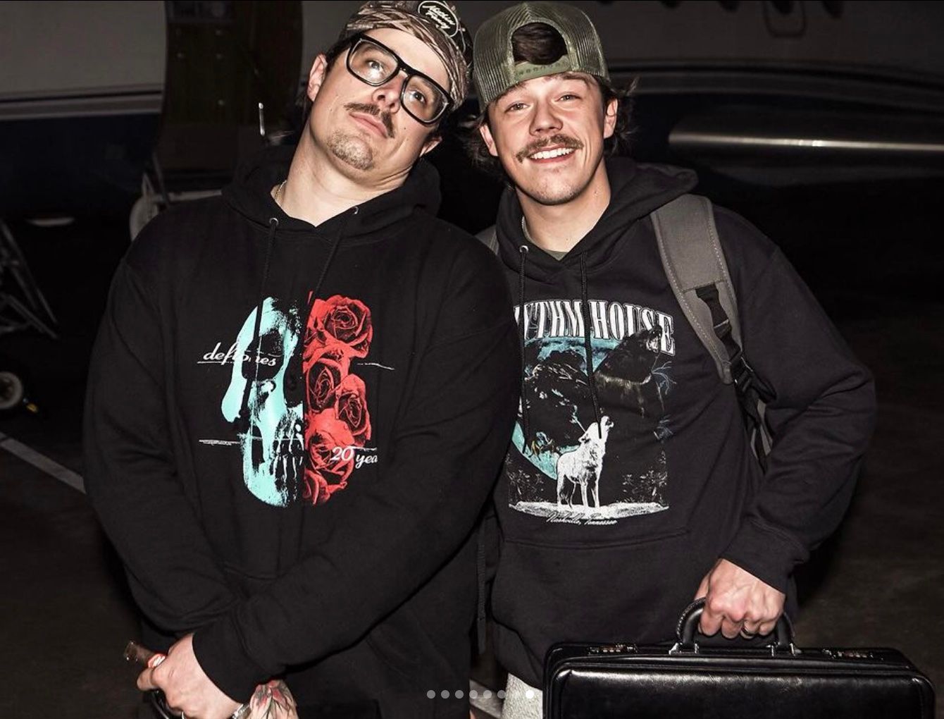 <p>Dylan Marlowe and HARDY in black hoodies next to each other</p>