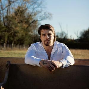 Gavin Adcock with cross on his hand