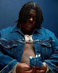 BigXthaPlug holding some blue darts