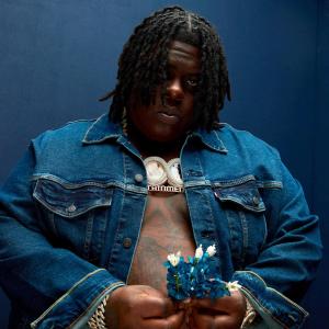 BigXthaPlug holding some blue darts