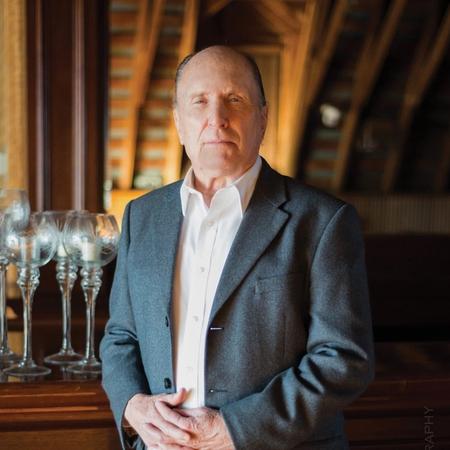 Robert Duvall stood at a bar