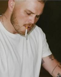 Zach Bryan playing piano