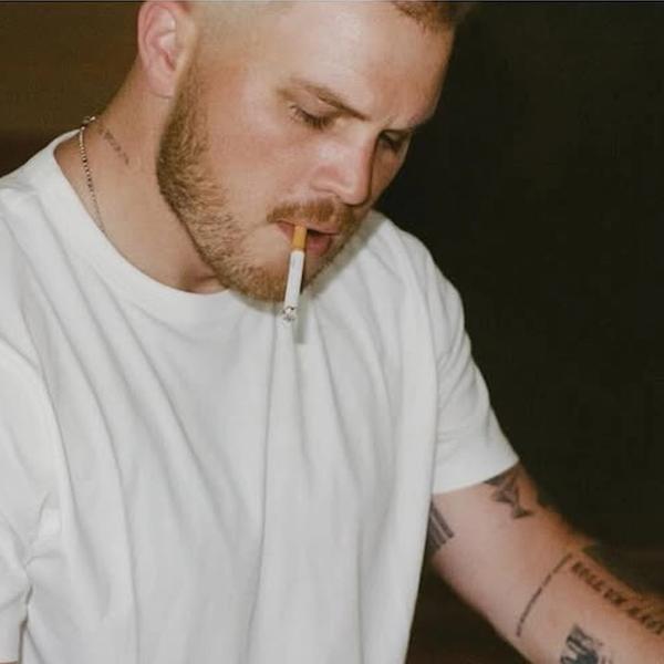 Zach Bryan playing piano