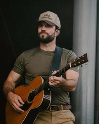 Sam Hunt holding a guitar