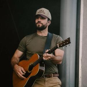Sam Hunt holding a guitar