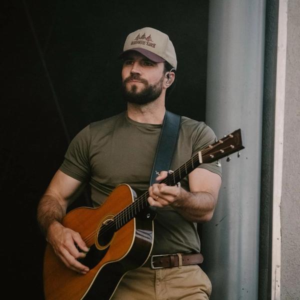 Sam Hunt holding a guitar