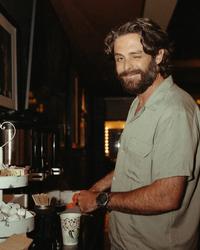 Thomas Rhett pouring himself a coffee