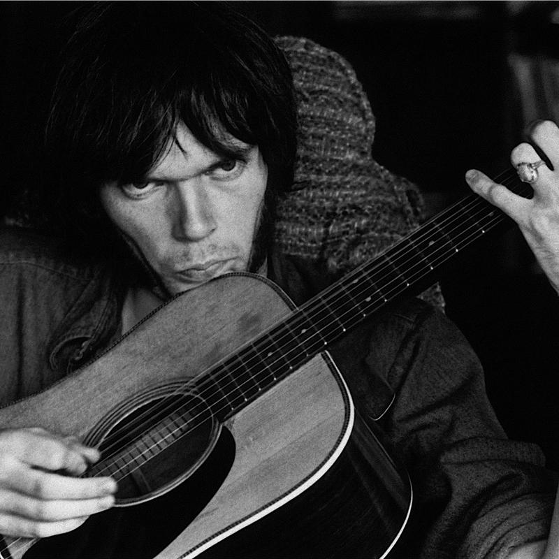 <p>'Neil Young Rehearsing for Deja Vu at Stephen’s House IV, 1969. Studio City, Los Angeles. When viewed closely, the bass string is vibrating'</p>