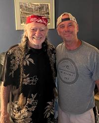 Kenny Chesney and Willie Nelson hugging