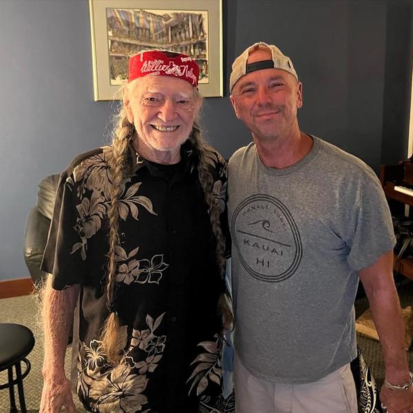 Kenny Chesney and Willie Nelson hugging