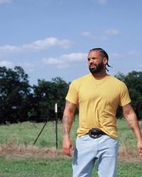 Drake wearing a belt buckle