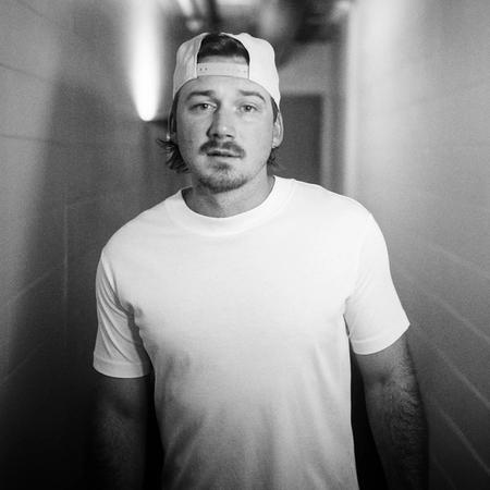 Morgan Wallen in a white t-shirt with a backwards cap