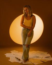 Ashley Cooke standing on lyrics