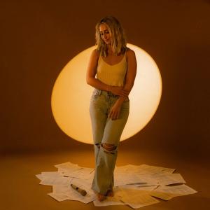 Ashley Cooke standing on lyrics