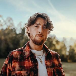 Bailey Zimmerman wearing flannel against a rural backdrop