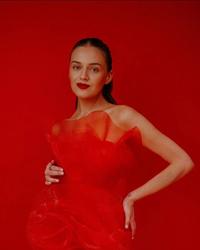 Kelsea Ballerini wearing a red dress