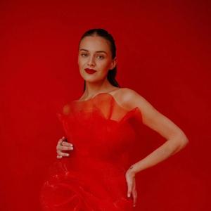 Kelsea Ballerini wearing a red dress