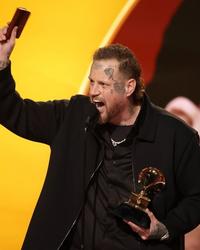 Jelly Roll holding a Bible during his Grammys 2026 acceptance speech