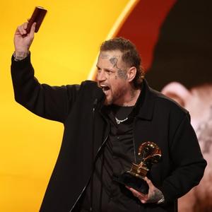 Jelly Roll holding a Bible during his Grammys 2026 acceptance speech