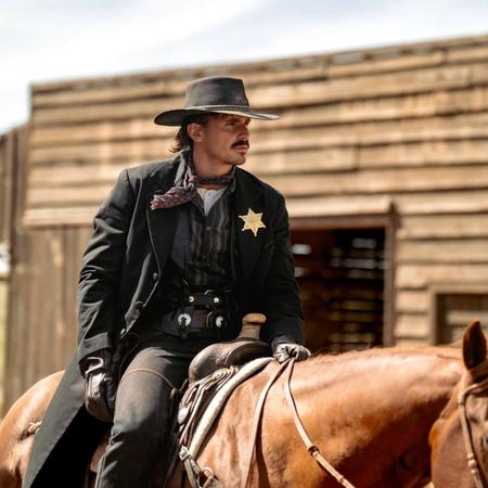 Tucker Wetmore riding a horse like a sheriff