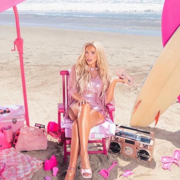 Megan Moroney on a beach in a deck chair