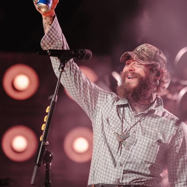 Post Malone holding up a Bud Light