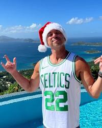 Kenny Chesney wearing a Santa Hat