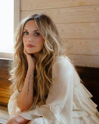 Carly Pearce in a Church pew