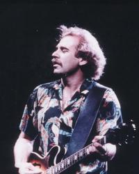 Jimmy Buffett performing in a Hawaiian shirt