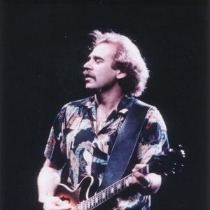 Jimmy Buffett performing in a Hawaiian shirt