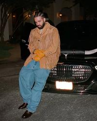 Drake wearing a tassled cowboy jacket