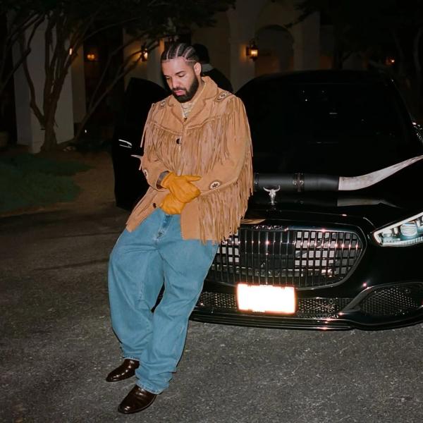 Drake wearing a tassled cowboy jacket