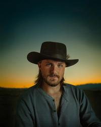 Jackson Dean against a sunset