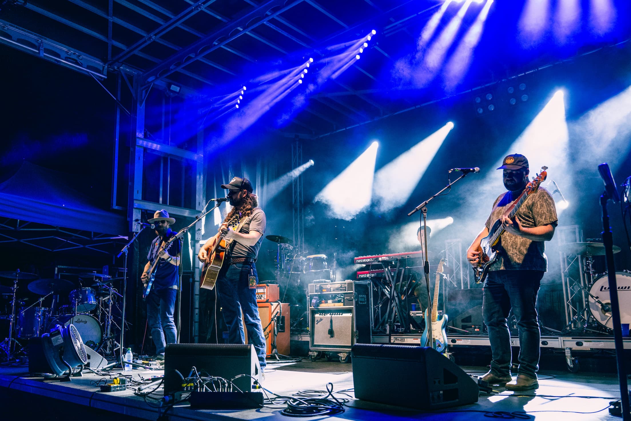 Brent Cobb and band playing at night under the stage lights at Orange Blossom Revue.