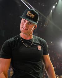 Parker McCollum looking at the camera on-stage