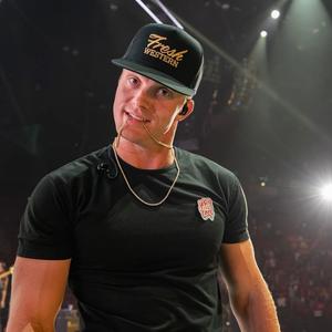 Parker McCollum looking at the camera on-stage