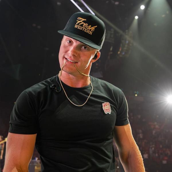Parker McCollum looking at the camera on-stage